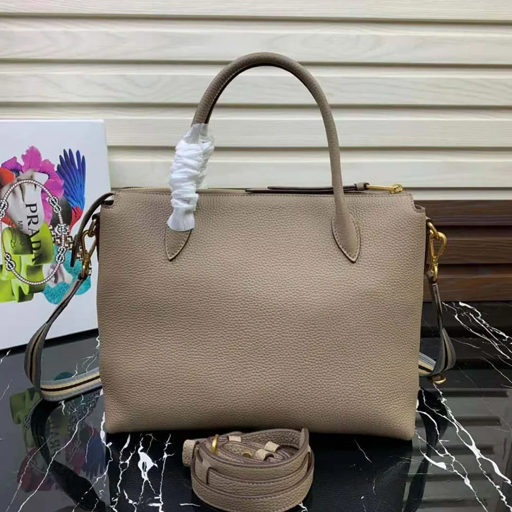 Prada Leather Handbag with Metal lettering Logo on the Front for Women in Beige Prada Leather Handbag with Metal lettering Logo on the Front for Women in Beige