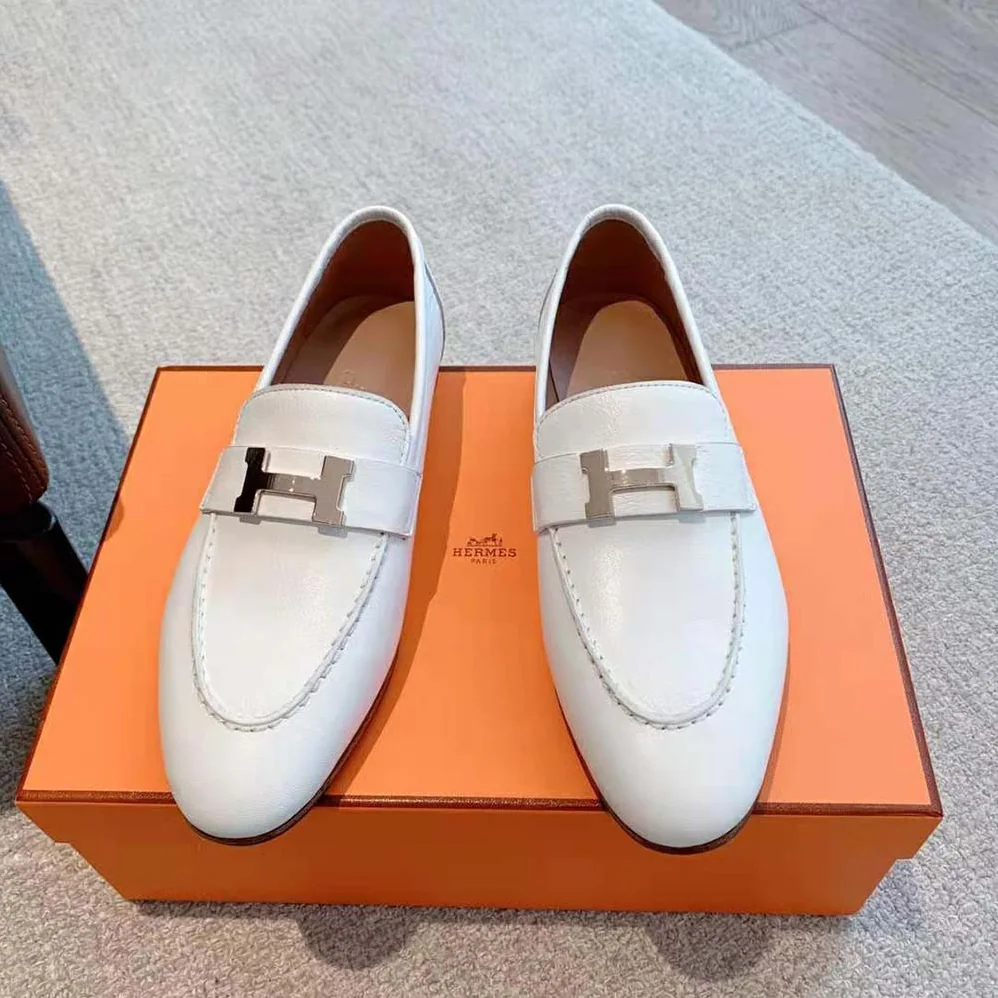Hermes Paris Loafer in Calfskin with Palladium Plated Signature “H” Detail for Women in White Hermes Paris Loafer in Calfskin with Palladium Plated Signature “H” Detail for Women in White