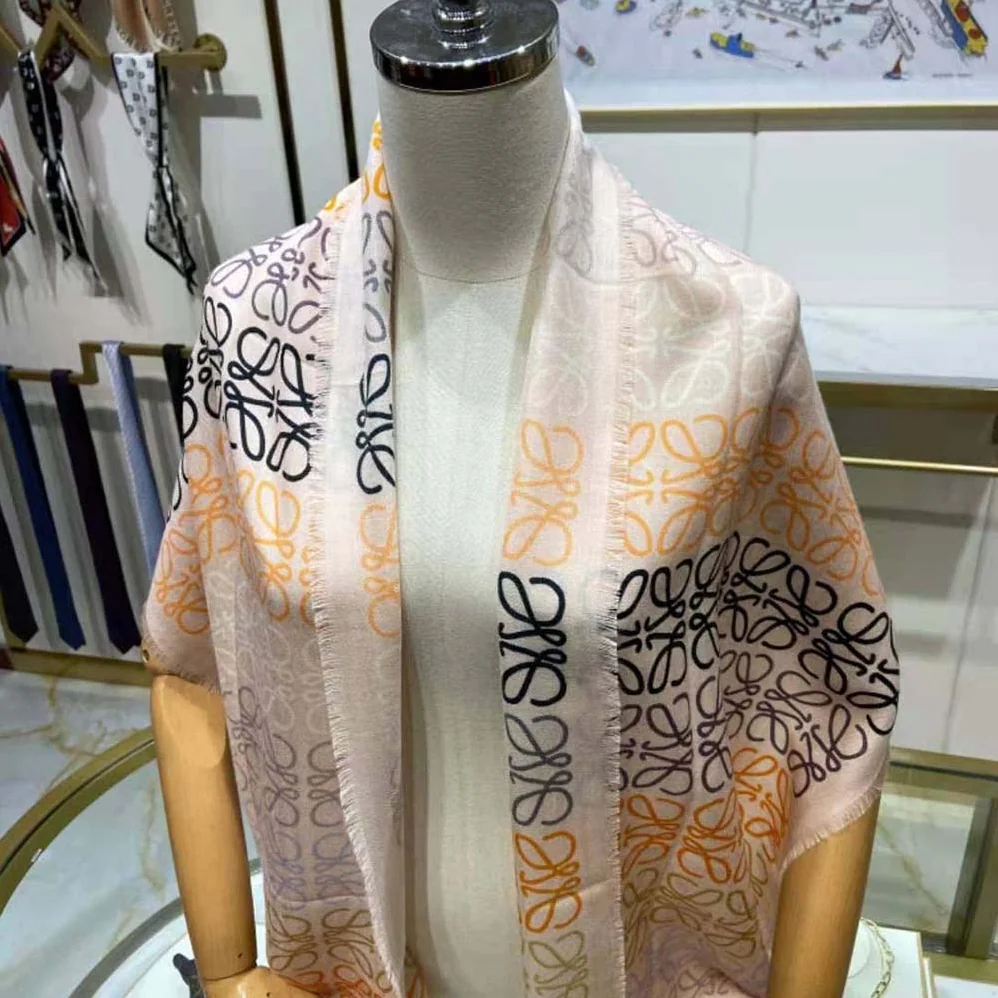 Loewe Anagram Lines Scarf in Wool and Cashmere for Women in White Loewe Anagram Lines Scarf in Wool and Cashmere for Women in White