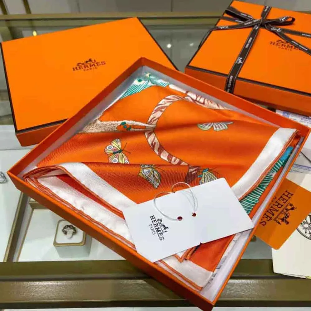 Hermes Hermes Story Scarf 90 in Silk Twill with Hand-Rolled Edges for Women in Orange