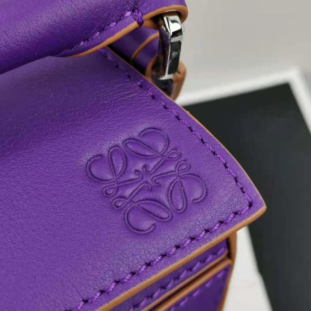 Loewe Mini Puzzle Bag in Classic Calfskin for Women in Purple Loewe Mini Puzzle Bag in Classic Calfskin for Women in Purple