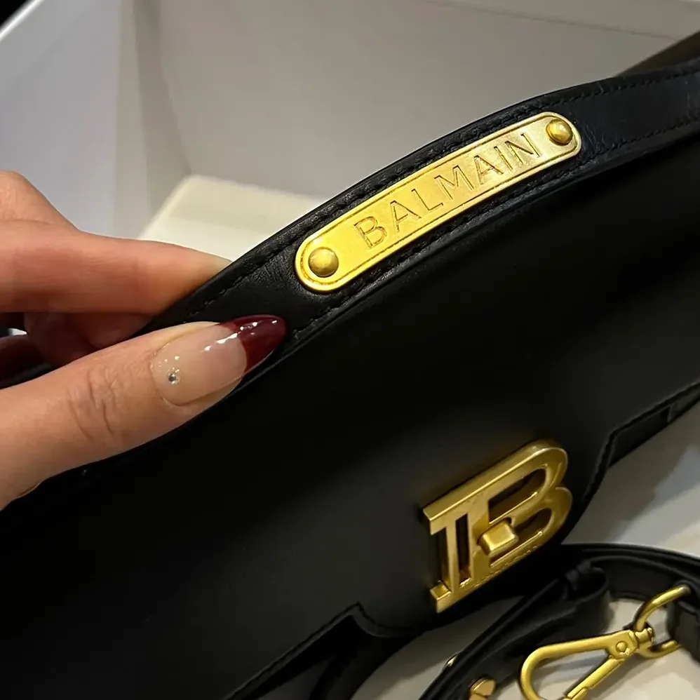 Balmain Smooth Leather B-Buzz 24 Bag for Women in Black