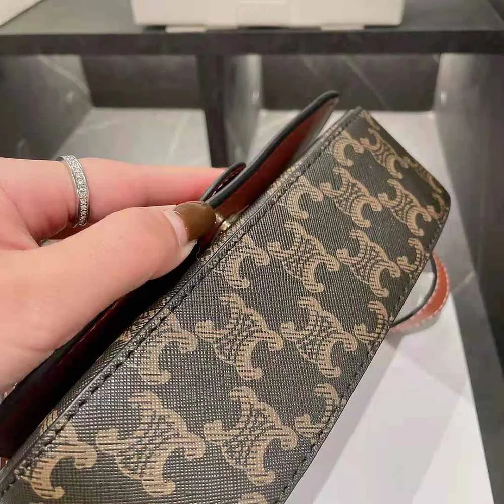 Celine Clutch on Strap in Triomphe Canvas and Calfskin for Women