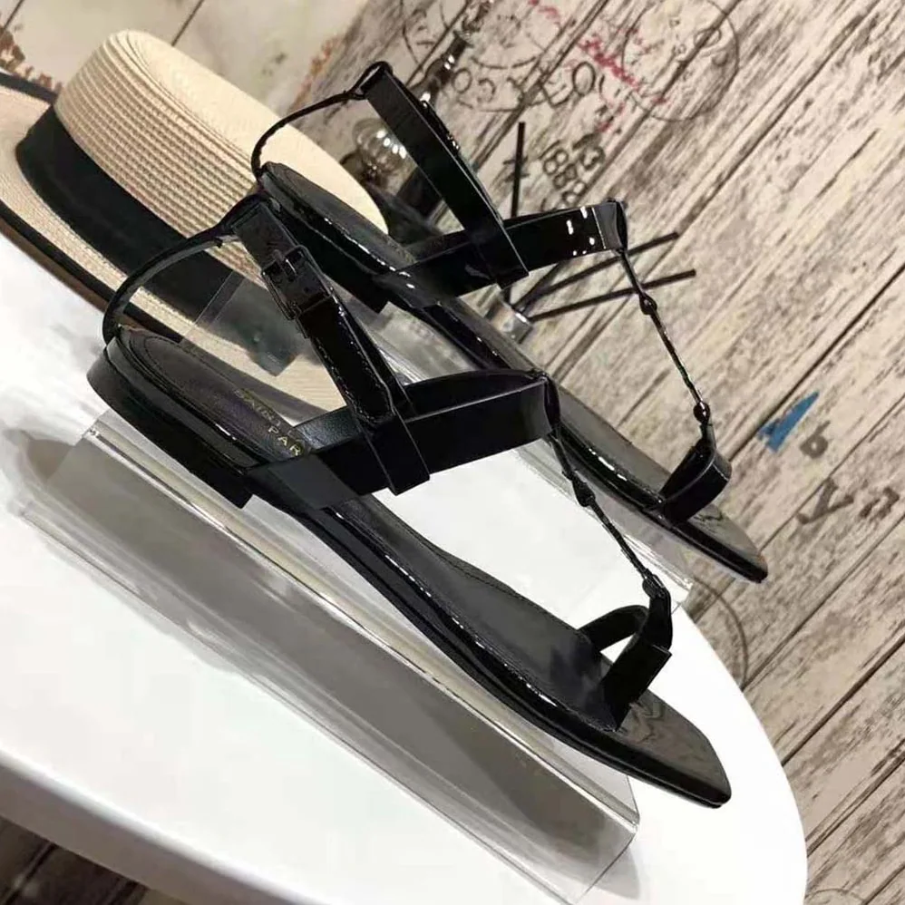 Saint Laurent YSL Cassandra Flat Sandals in Patent Leather with Silver for Women in Tone Monogram