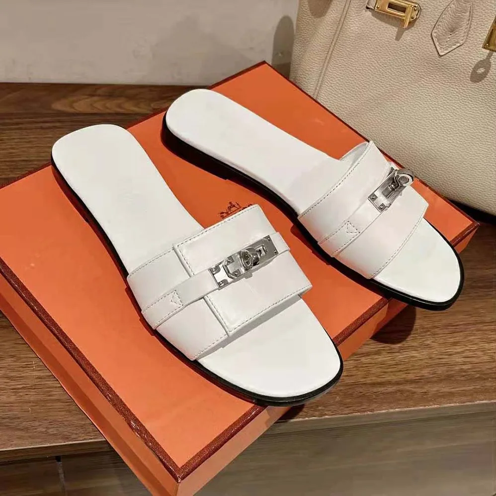 Hermes Giulia Sandal in Calfskin with Iconic Palladium-Plated Kelly Buckle for Women in White Hermes Giulia Sandal in Calfskin with Iconic Palladium-Plated Kelly Buckle for Women in White