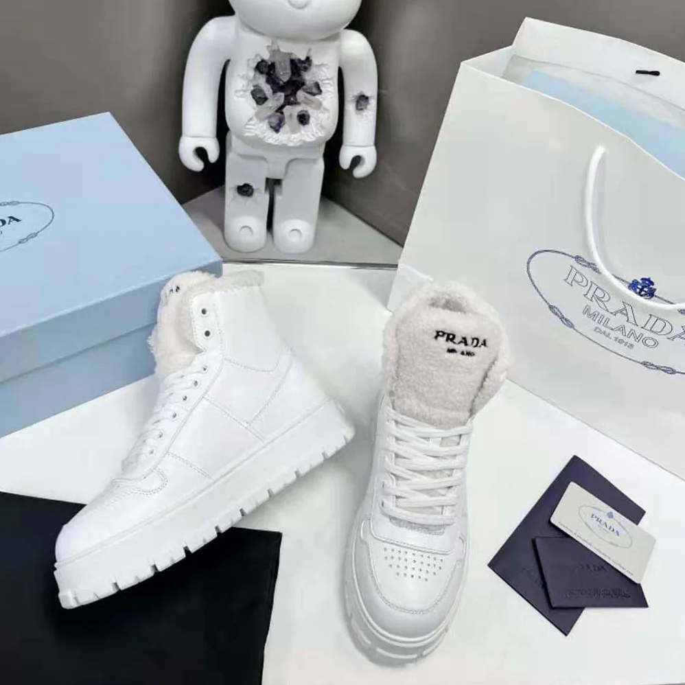 Prada Leather and Shearling High-Top Sneakers for Women in White Prada Leather and Shearling High-Top Sneakers for Women in White