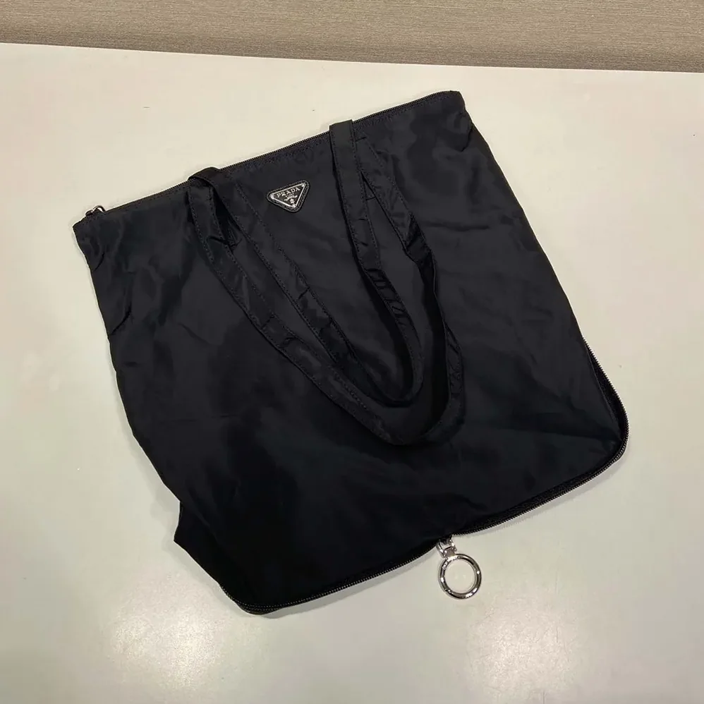 Prada Saffiano Leather Pendant With Re-Nylon Tote Bag for Women in Black Prada Saffiano Leather Pendant With Re-Nylon Tote Bag for Women in Black
