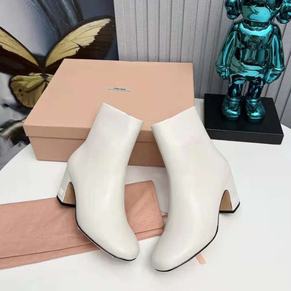 Miu Miu Leather Booties with Metal Lettering Logo for Women in White