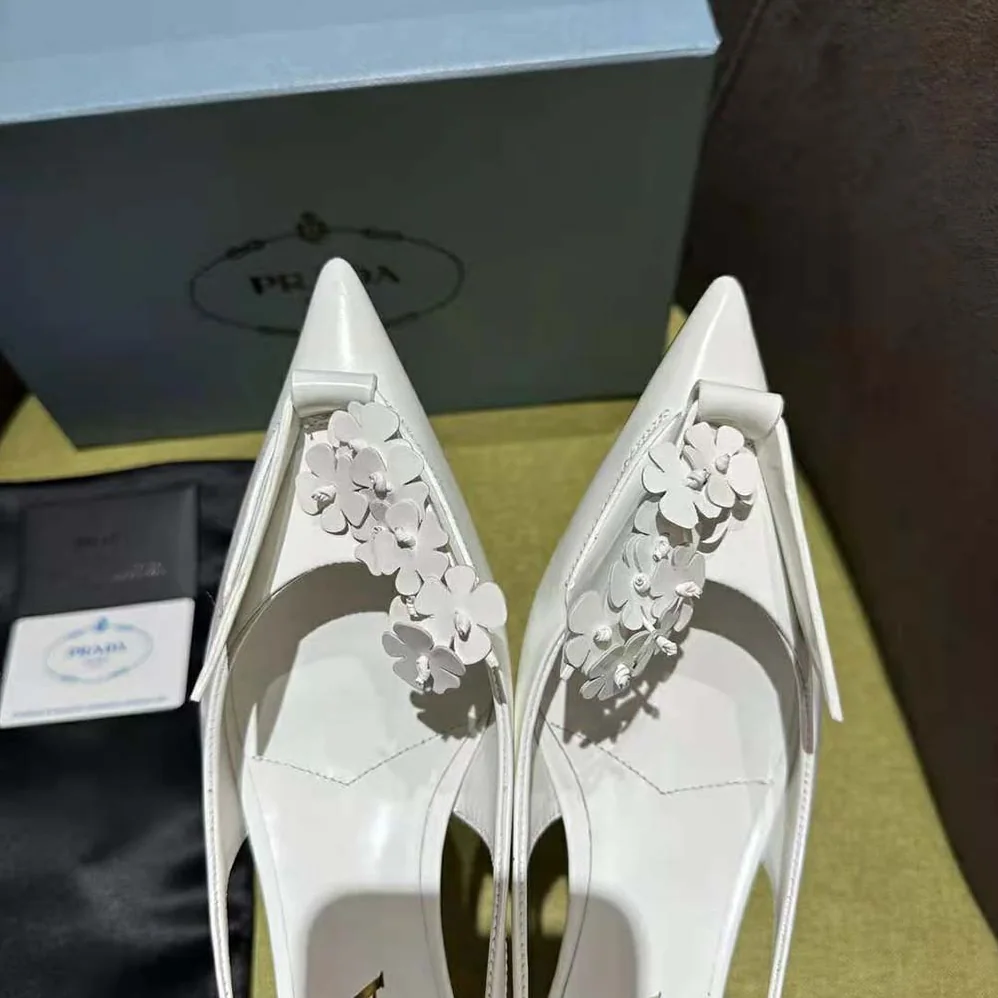 Prada Brushed Leather Slingback Pumps with Floral Appliques for Women in White Prada Brushed Leather Slingback Pumps with Floral Appliques for Women in White