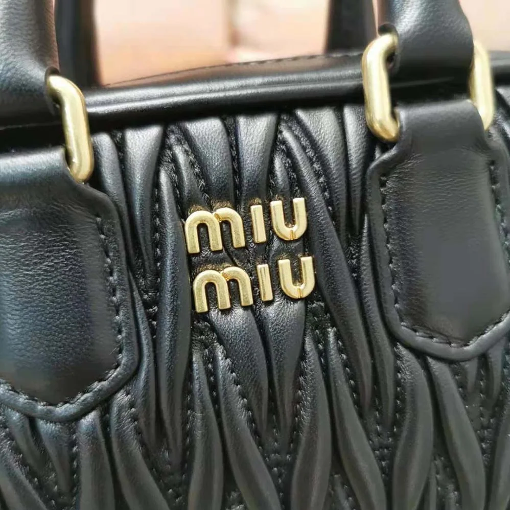 Miu Miu Matelassé Nappa Leather Top-Handle Mini-Bag for Women in Black Miu Miu Matelassé Nappa Leather Top-Handle Mini-Bag for Women in Black