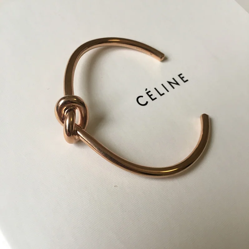 Celine Knot Extra-Thin Bracelet in Brass with Rhodium Finish for Women in Gold