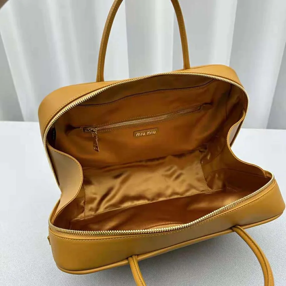 Miu Miu Leather Top-handle Bag with Embossed Lettering Logo for Women in Orange Miu Miu Leather Top-handle Bag with Embossed Lettering Logo for Women in Orange
