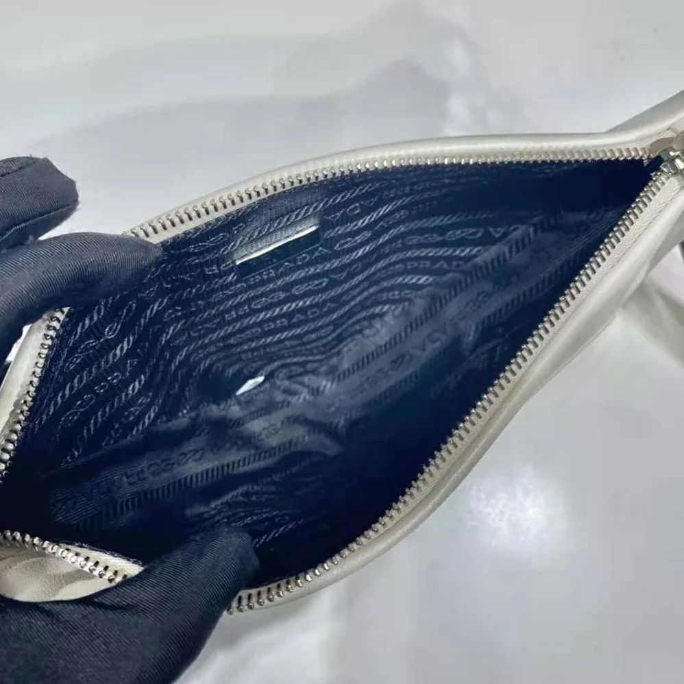 Prada Leather Triangle Leather Pouch for Women in White Prada Leather Triangle Leather Pouch for Women in White
