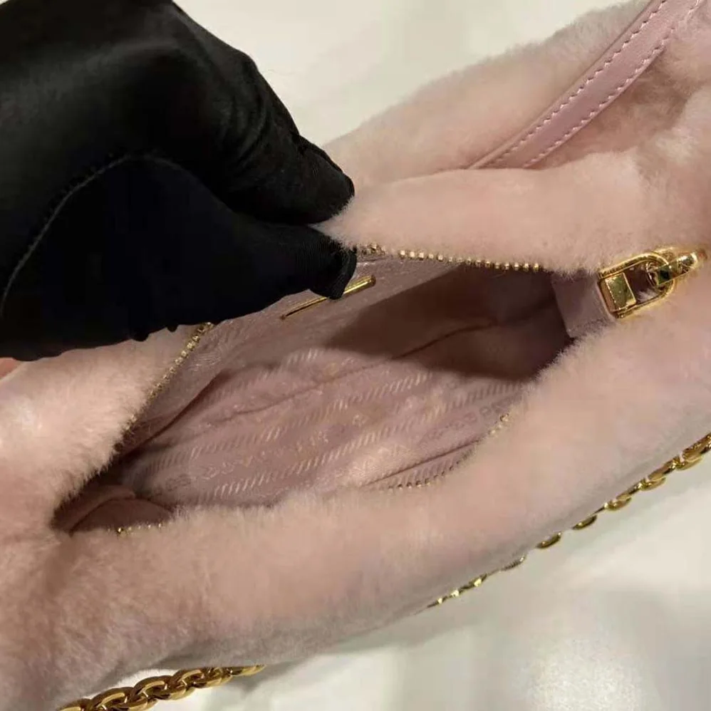 Prada Shearling Mini-Bag with the Enameled Metal Triangle Logo for Women in Pink Prada Shearling Mini-Bag with the Enameled Metal Triangle Logo for Women in Pink