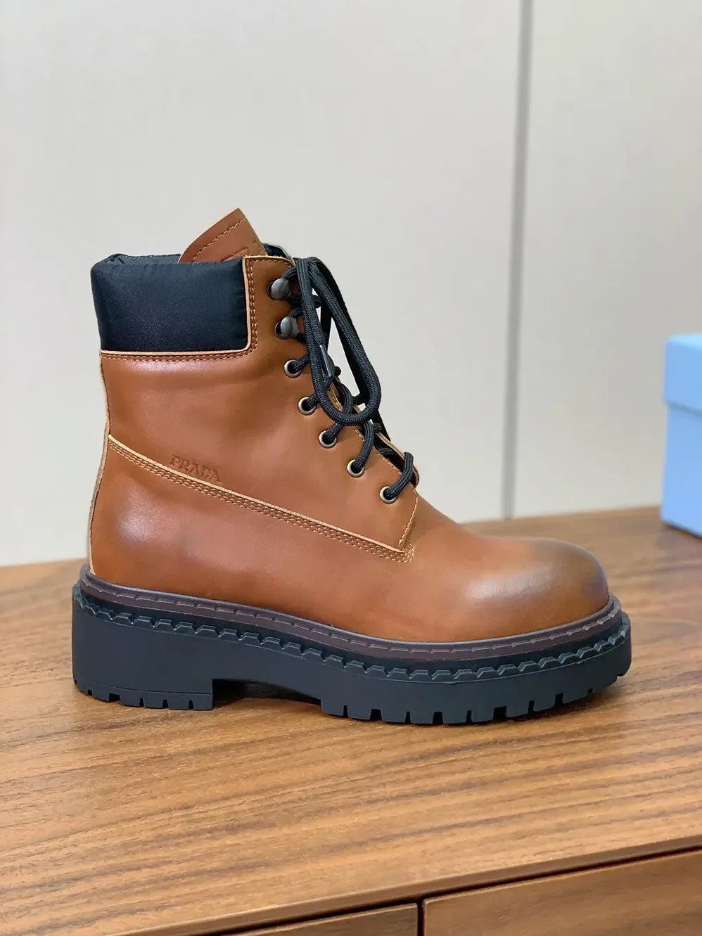 Prada Leather and Re-Nylon booties for Unisex in Ebony