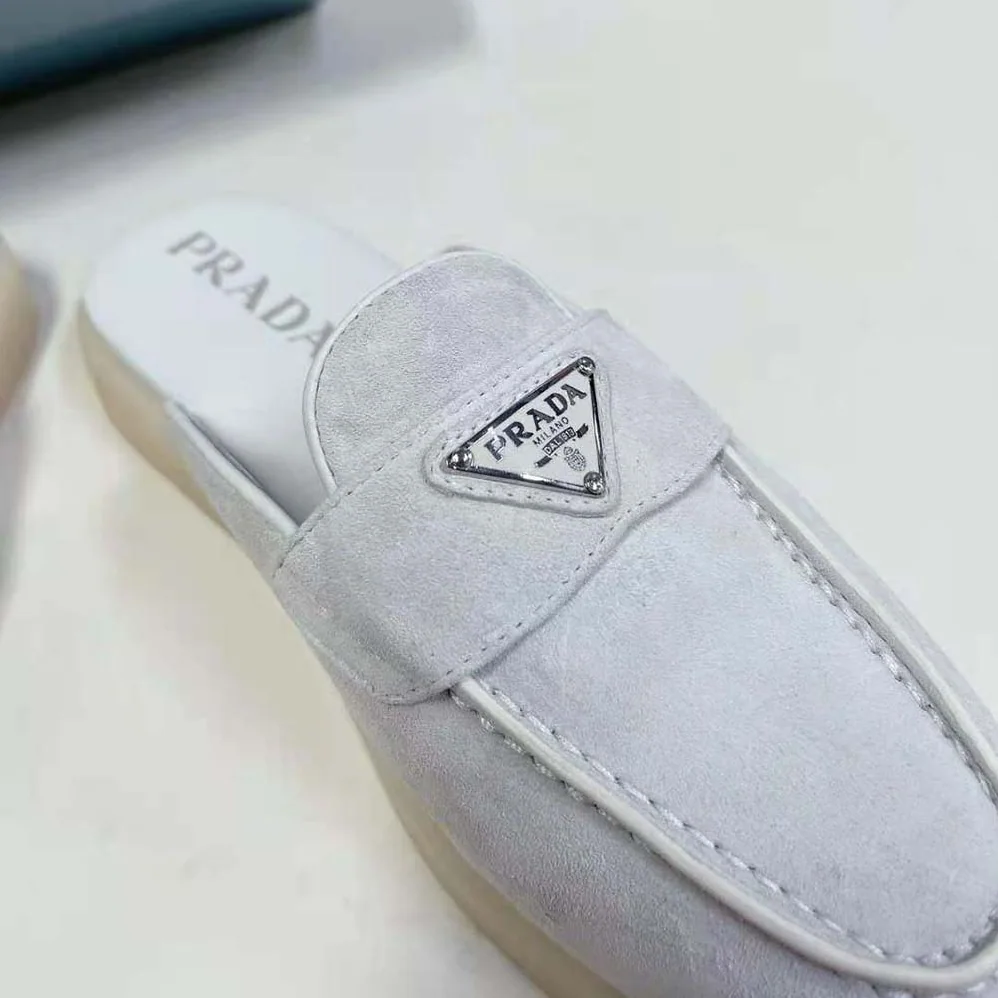 Prada Suede Leather Sabots with Enameled Metal Triangle Logo for Unisex in White