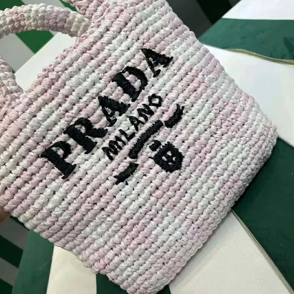 Prada Small Crochet Tote Bag with Embroidered Lettering Logo for Women in Pink Prada Small Crochet Tote Bag with Embroidered Lettering Logo for Women in Pink