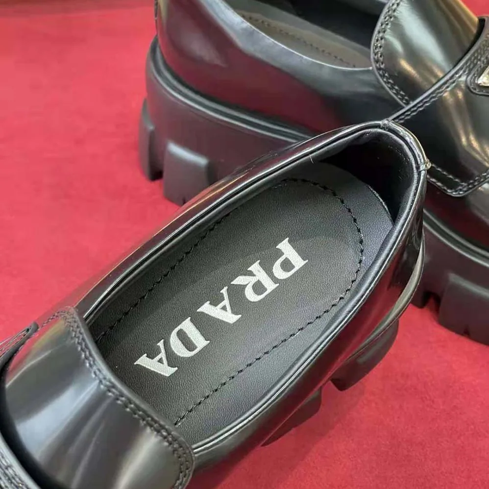 Prada Brushed Leather Monolith Loafers for Unisex in Black