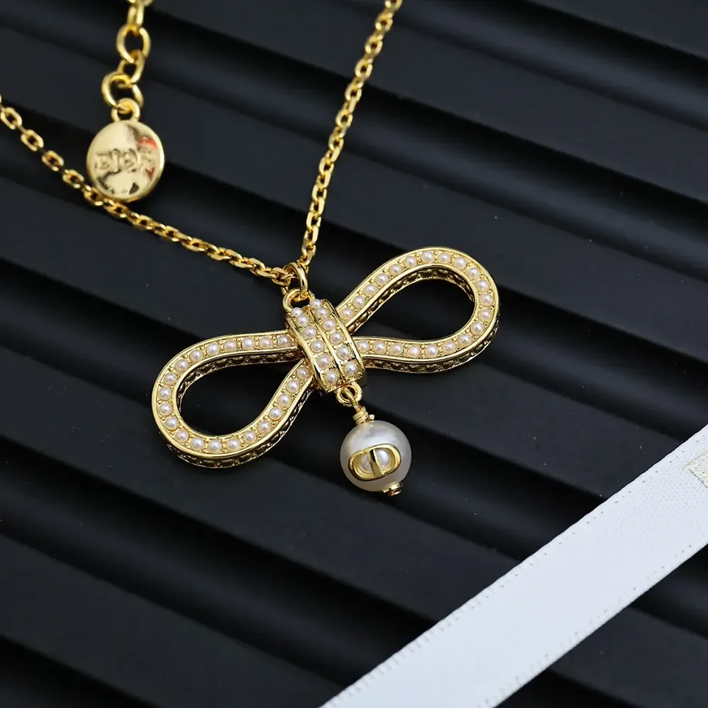 Dior Le Nœud de Dior Necklace Champagne-Finish Metal with a White Resin Pearl for Women Dior Le Nœud de Dior Necklace Champagne-Finish Metal with a White Resin Pearl for Women