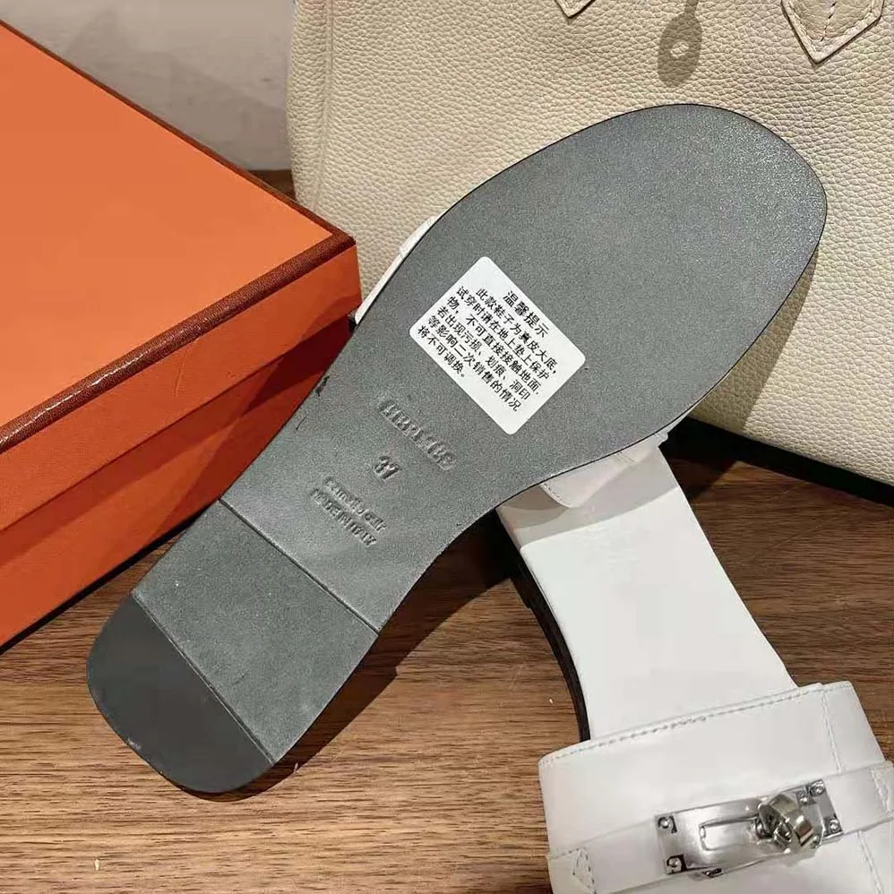 Hermes Giulia Sandal in Calfskin with Iconic Palladium-Plated Kelly Buckle for Women in White Hermes Giulia Sandal in Calfskin with Iconic Palladium-Plated Kelly Buckle for Women in White