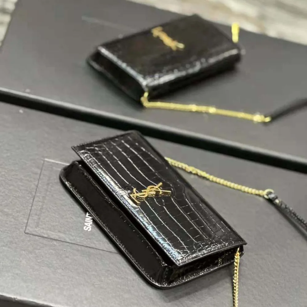 Saint Laurent YSL Cassandre Phone Holder with Strap in Shiny Crocodile-Embossed Leather for Women in Black Saint Laurent YSL Cassandre Phone Holder with Strap in Shiny Crocodile-Embossed Leather for Women in Black
