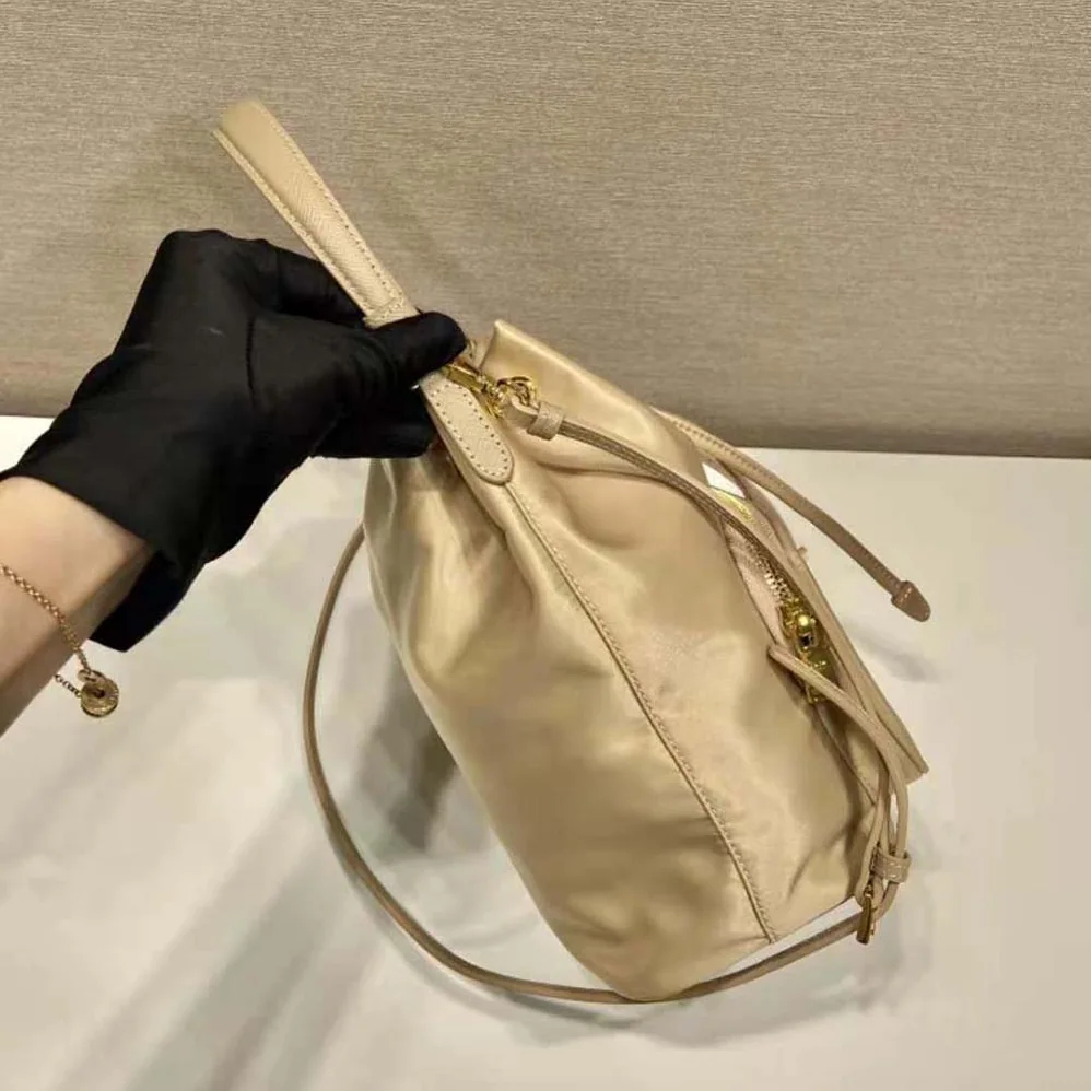 Prada Duet Re-Nylon Bucket Bag for Women in Beige
