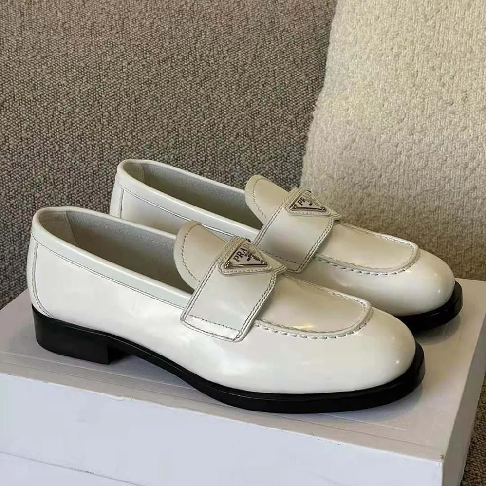 Prada Patent Leather Loafers in 25 mm Heel Height for Women in White Prada Patent Leather Loafers in 25 mm Heel Height for Women in White