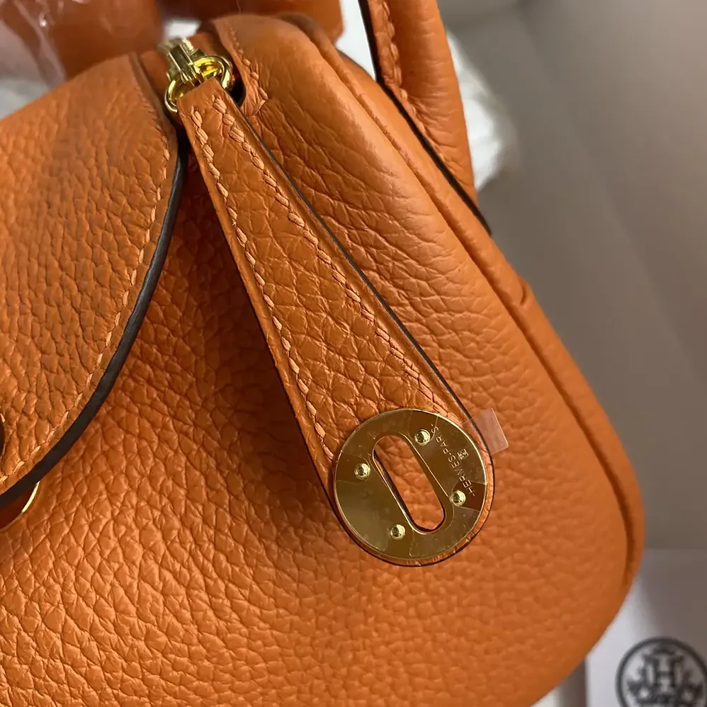 Hermes Lindy Mini 19 in Clemence Leather for Women in Orange/Gold Hermes Lindy Mini 19 in Clemence Leather for Women in Orange/Gold