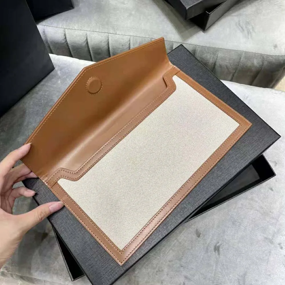 Saint Laurent YSL Uptown Pouch in Canvas and Smooth Leather for Women
