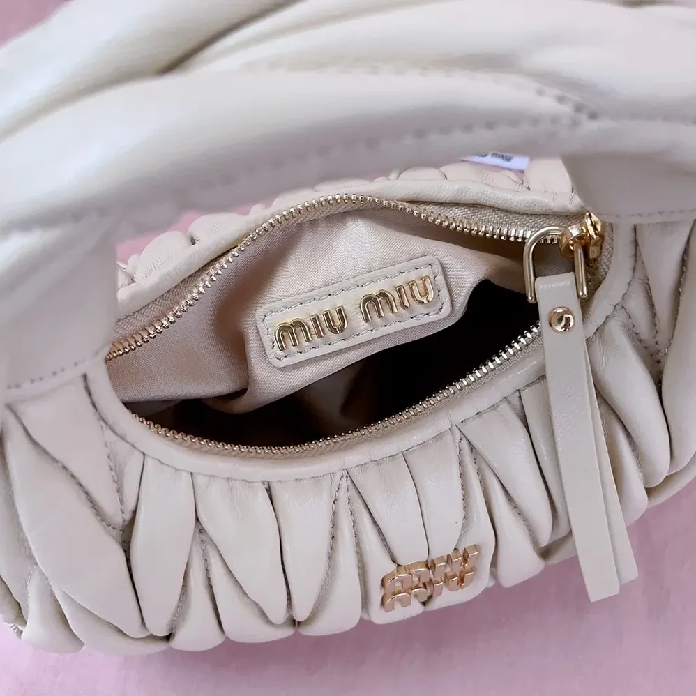 Miu Miu Wander Matelassé Nappa Leather Hobo Mini-Bag for Women in Light Yellow Miu Miu Wander Matelassé Nappa Leather Hobo Mini-Bag for Women in Light Yellow