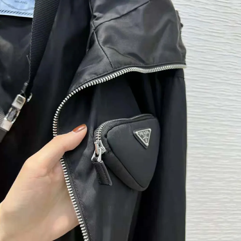 Prada Re-Nylon Hooded Blouson Jacket with Pouch for Women in Black Prada Re-Nylon Hooded Blouson Jacket with Pouch for Women in Black