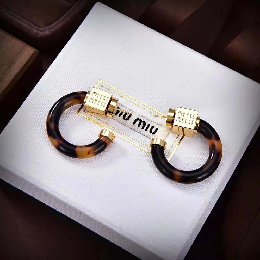 Miu Miu Plexiglas and Metal Earrings for Women Miu Miu Plexiglas and Metal Earrings for Women