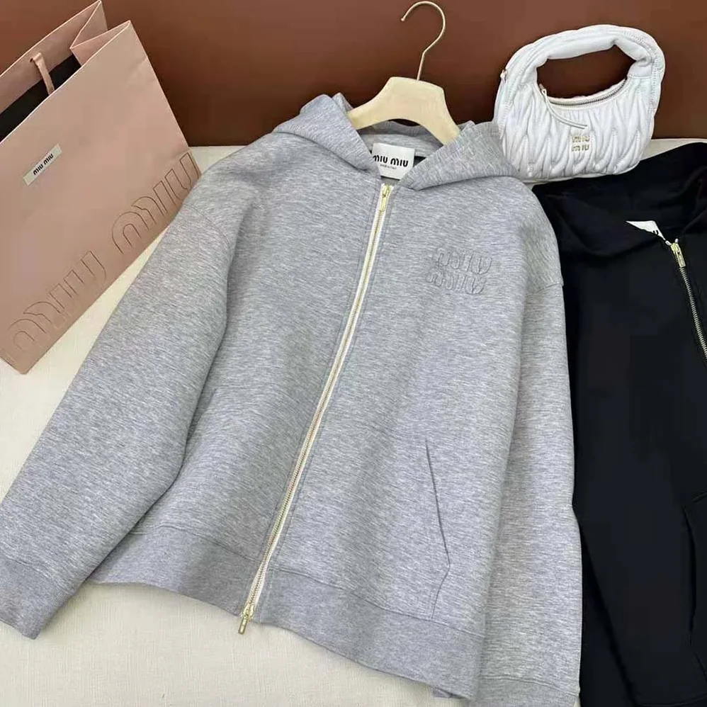Miu Miu Embroidered Cotton Fleece Hoodie with Embroidered Logo for Women in Silver Miu Miu Embroidered Cotton Fleece Hoodie with Embroidered Logo for Women in Silver