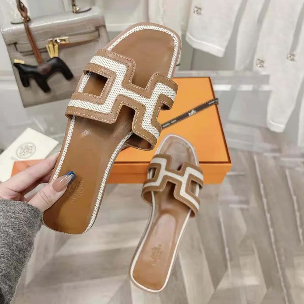 Hermes Oran Sandal in Calfskin and H Canvas with Iconic H Cut for Women in Out Hermes Oran Sandal in Calfskin and H Canvas with Iconic H Cut for Women in Out