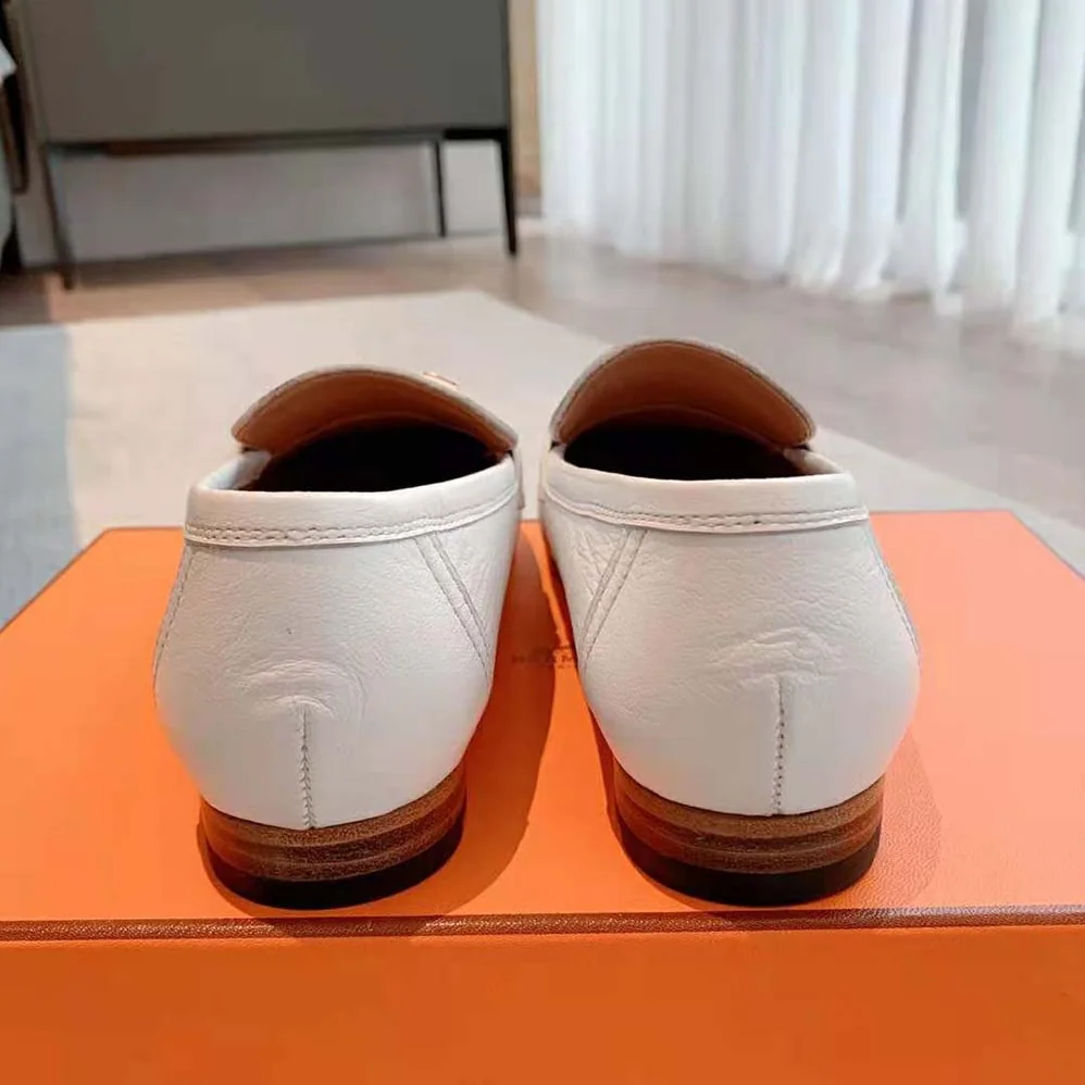 Hermes Paris Loafer in Calfskin with Palladium Plated Signature “H” Detail for Women in White Hermes Paris Loafer in Calfskin with Palladium Plated Signature “H” Detail for Women in White