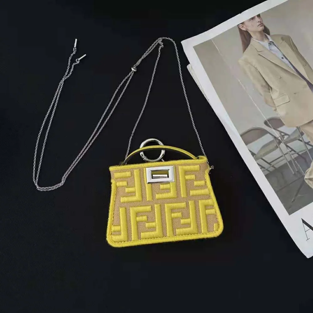 Fendi Nano Peekaboo Charm Gray FF Canvas Charm for Women in Yellow Fendi Nano Peekaboo Charm Gray FF Canvas Charm for Women in Yellow