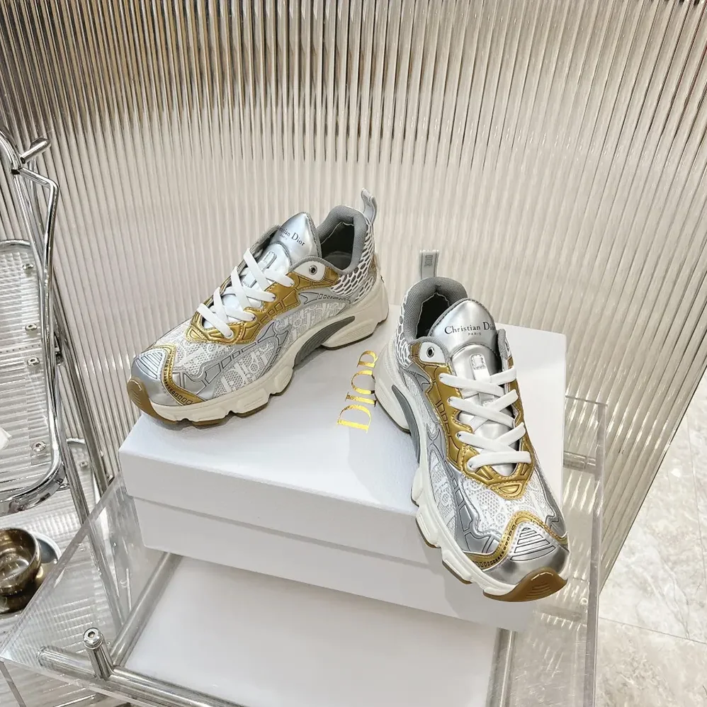 Dior Vibe Sneaker White Mesh Printed with Dior Oblique Motif and Gold- and Silver in Tone Dior Vibe Sneaker White Mesh Printed with Dior Oblique Motif and Gold- and Silver in Tone