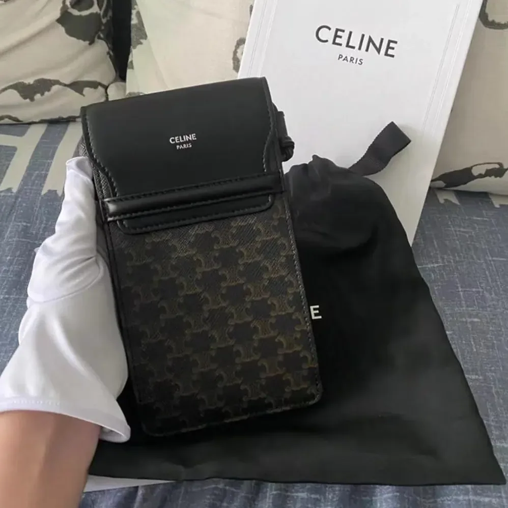 Celine Phone Pouch with Flap in Triomphe Canvas and Lambskin for Women in Black Celine Phone Pouch with Flap in Triomphe Canvas and Lambskin for Women in Black