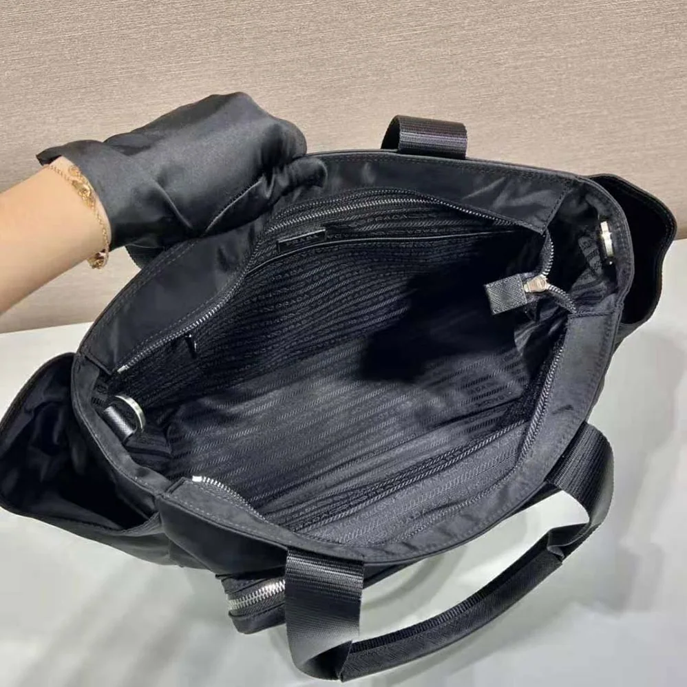 Prada Re-Nylon Baby Bag with Re-Nylon logo-Print lining for Women in Black