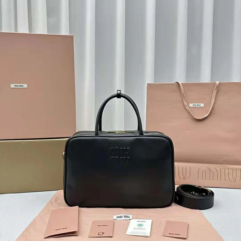 Miu Miu Leather Top-handle Bag with Embossed Lettering Logo for Women in Black Miu Miu Leather Top-handle Bag with Embossed Lettering Logo for Women in Black
