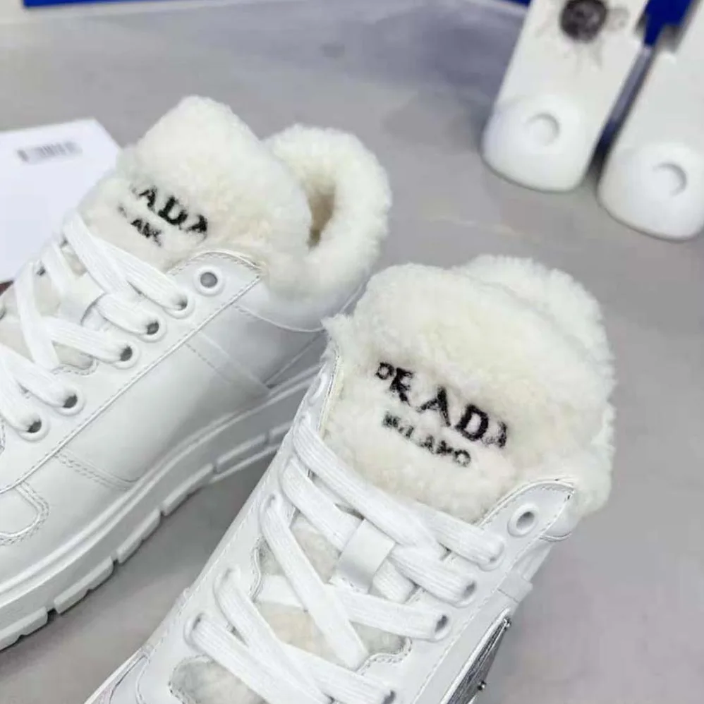 Prada Leather and Shearling Sneakers for Women in White