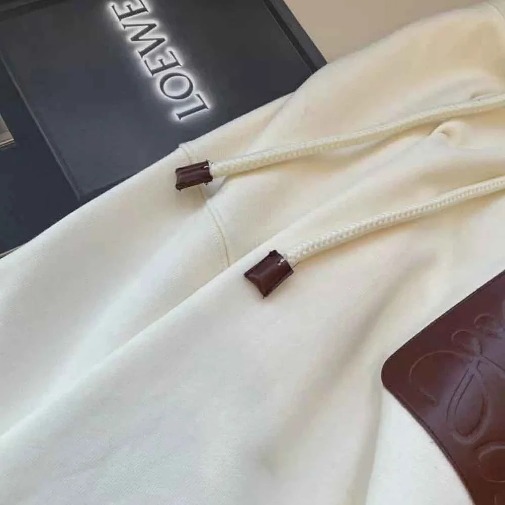 Loewe Anagram Patch Hoodie in Cotton for Women in White Loewe Anagram Patch Hoodie in Cotton for Women in White