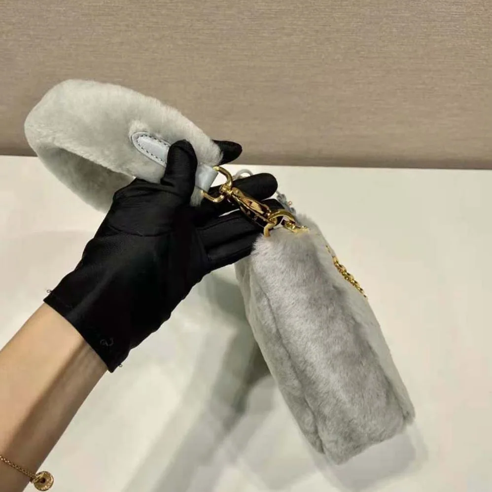 Prada Shearling Mini-Bag with the Enameled Metal Triangle Logo for Women in Silver