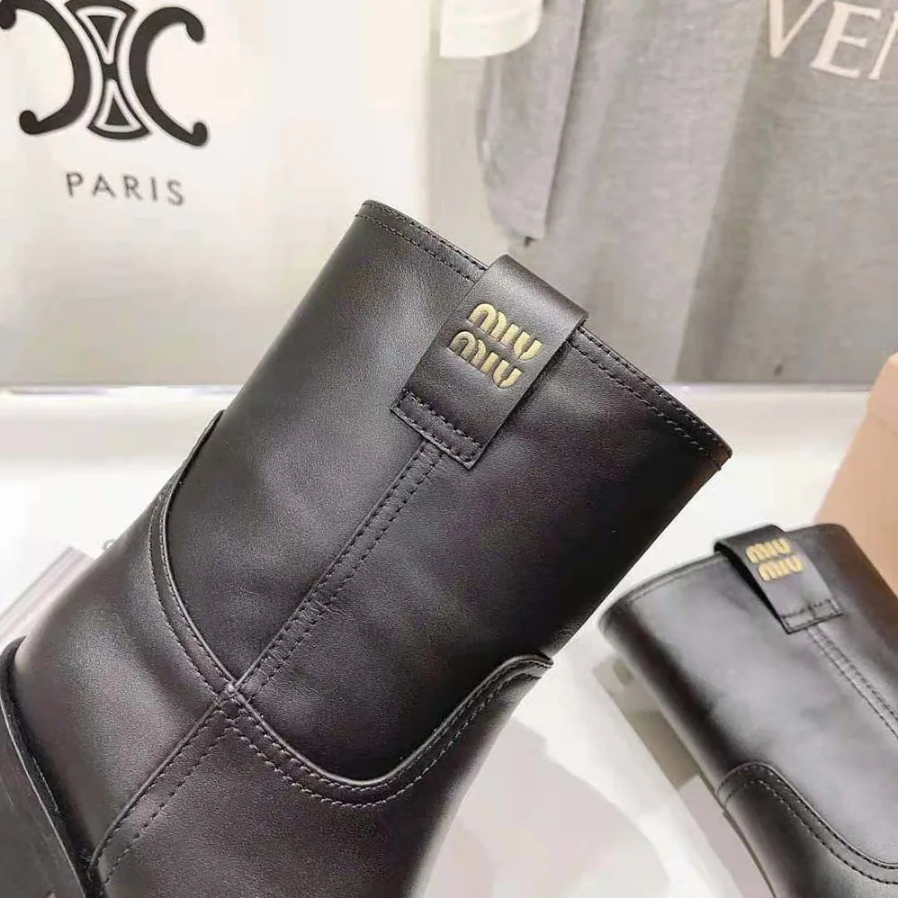 Miu Miu Leather Booties with Hot-stamped Logo for Women in Black
