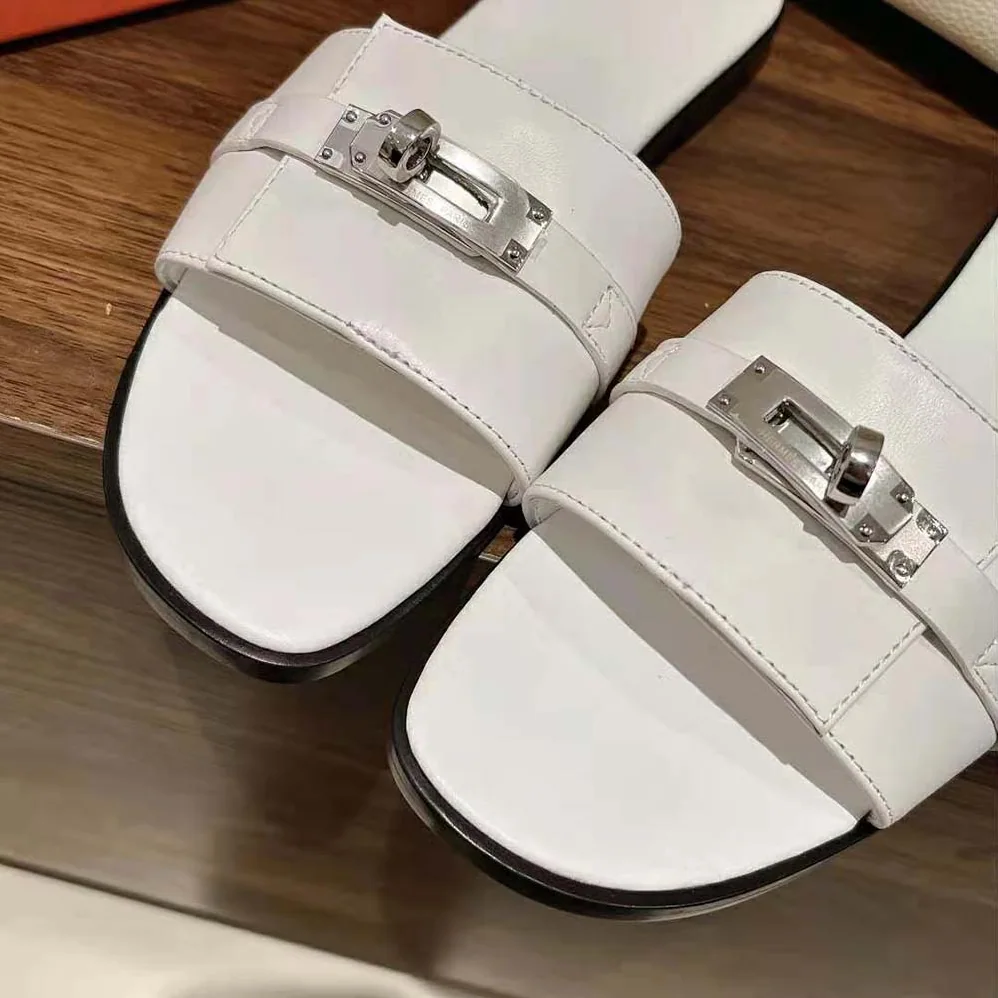 Hermes Giulia Sandal in Calfskin with Iconic Palladium-Plated Kelly Buckle for Women in White Hermes Giulia Sandal in Calfskin with Iconic Palladium-Plated Kelly Buckle for Women in White