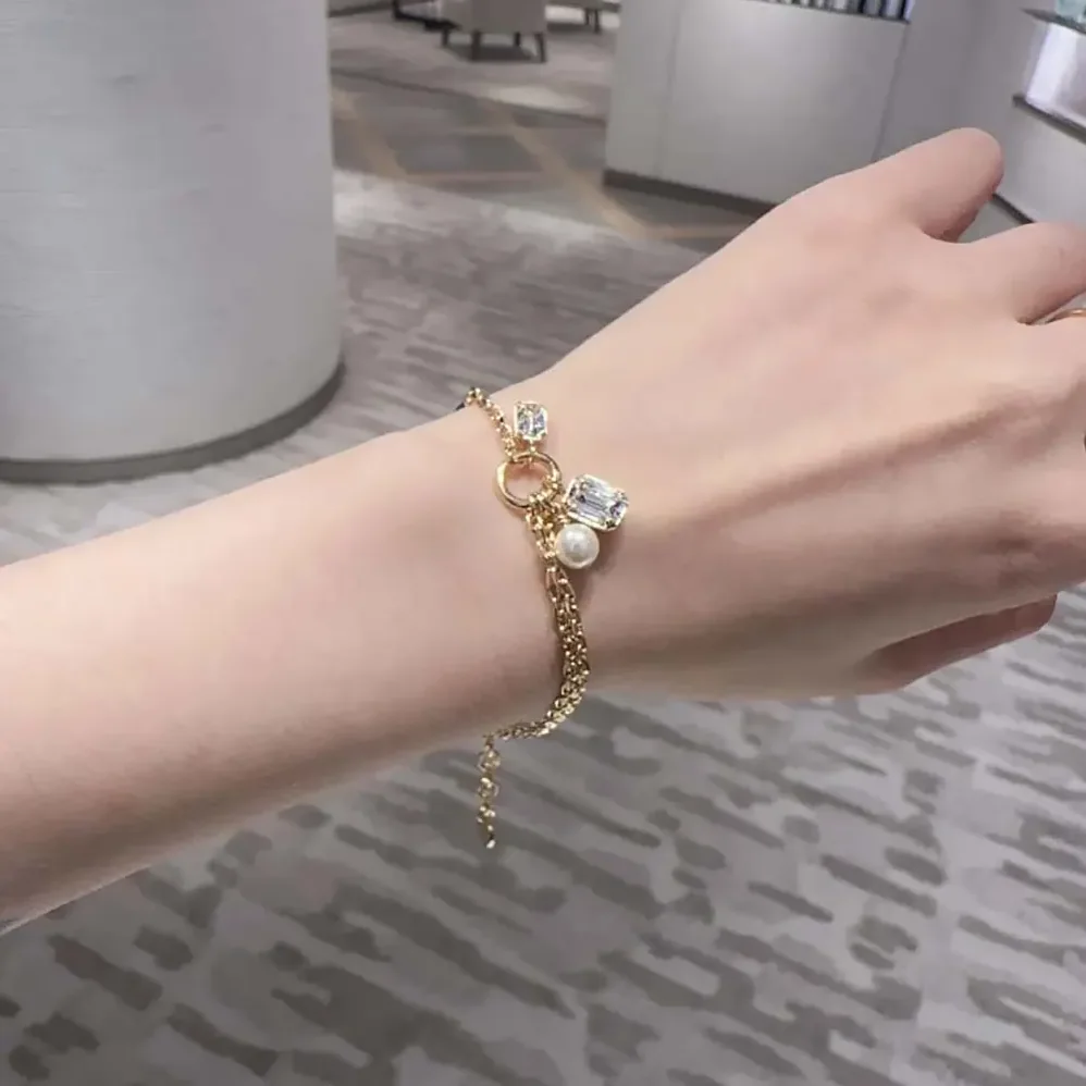Dior Petit CD Bracelet Gold-Finish Metal with a White Resin Pearl and Silver for Women in Tone Crystals Dior Petit CD Bracelet Gold-Finish Metal with a White Resin Pearl and Silver for Women in Tone Crystals