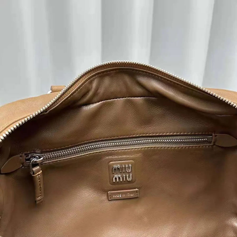 Miu Miu Nappa Leather Top-handle Bag with Embossed Lettering Logo for Women in Brown