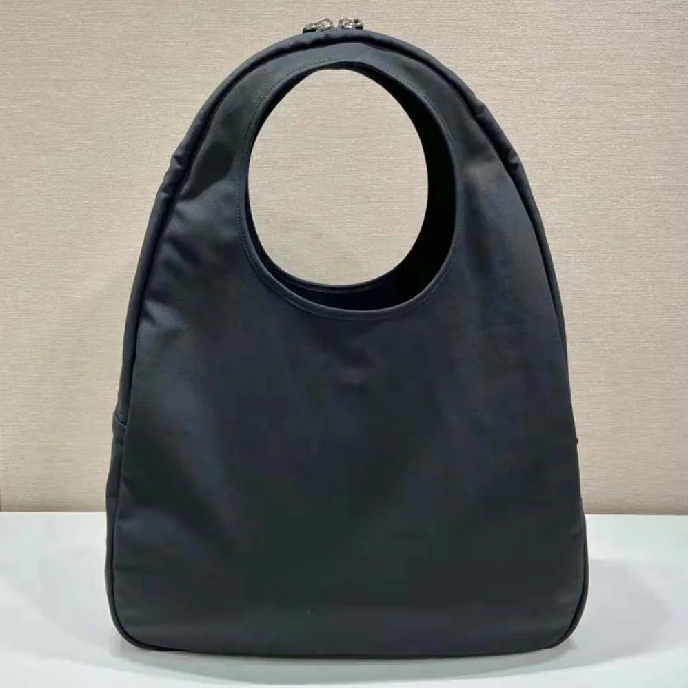 Prada Canvas Hobo Bag with Embossed Logo on the Front for Men in Black Prada Canvas Hobo Bag with Embossed Logo on the Front for Men in Black