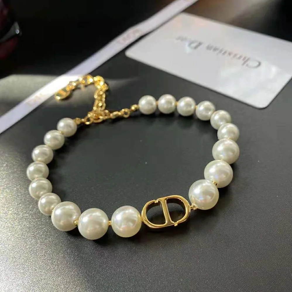 Dior 30 Montaigne Bracelet Gold-Finish Metal and White Resin Pearls for Women Dior 30 Montaigne Bracelet Gold-Finish Metal and White Resin Pearls for Women