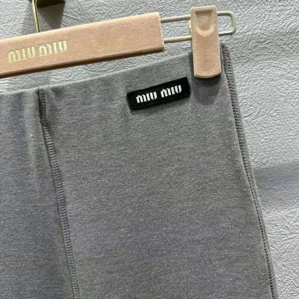 Miu Miu Silk Jersey Pants with Logo Patch for Women in Gray